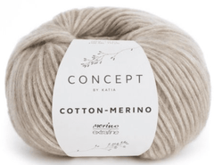 A ball of light beige Katia Cotton-Merino yarn features soft Merino in a chainette cotton tube, labeled with a simple botanical design and "Katia Cotton-Merino, merino extrafine.