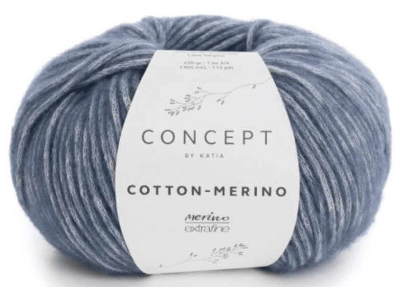A ball of blue and white variegated Katia Cotton-Merino yarn features a super soft Merino blend in a chainette cotton tube, with product details and a leaf design on the Katia label.
