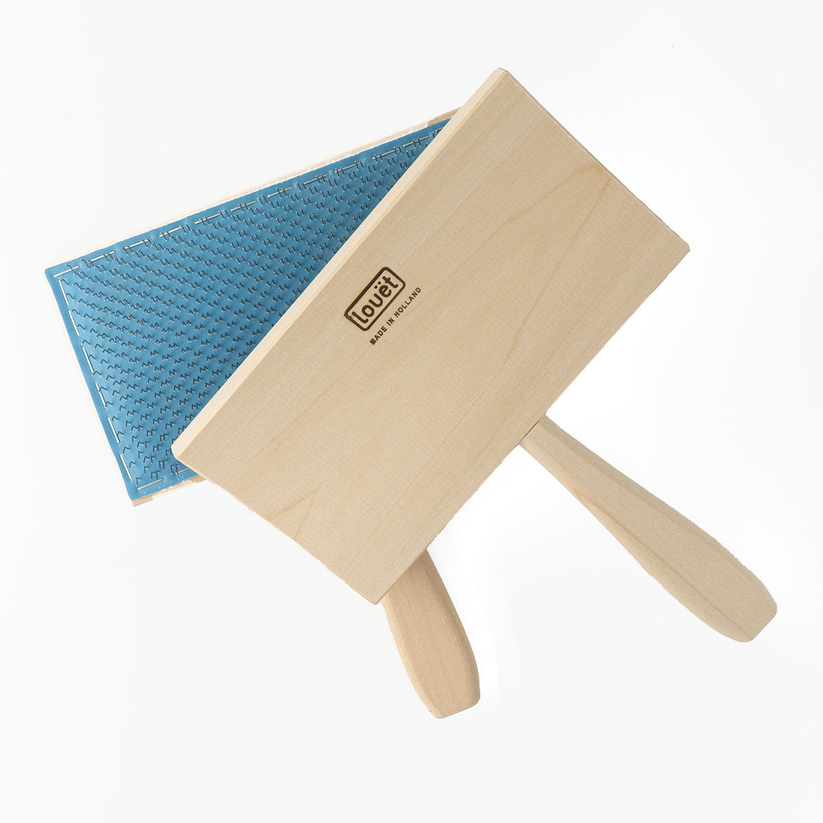 Two Louët Wool Carders measuring 7½"x4" each, from Louet Inc., form an overlapping cross on a white background. One carder features blue bristles ideal for wool, while the other has a plain wood finish and the "Louët" logo.