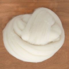 A coil of Fine White Merino Wool Top, soft white merino wool roving for needle felting.