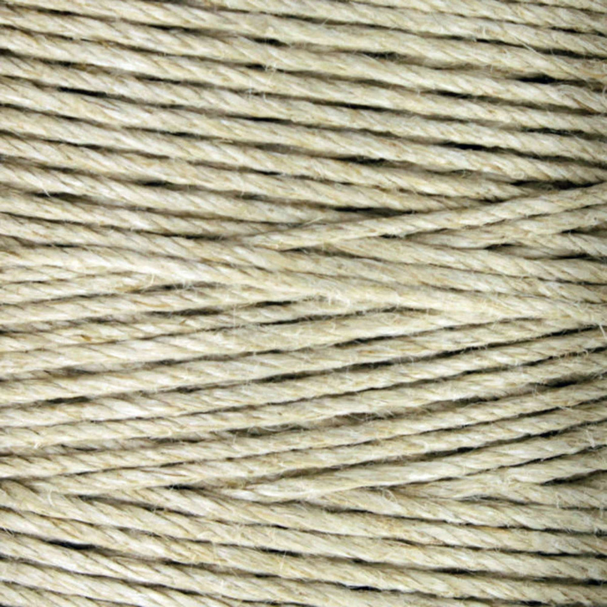 Close-up of Soft Finish Linen Warps by Kingfisher Yarn & Fibre, showing natural-colored twine with visible texture and individual fibers twisted in parallel strands, ideal for tapestry weaving.