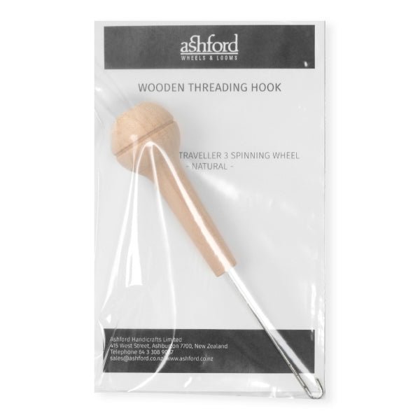 The Ashford Handicrafts Limited Wooden Threading Hook, designed for Traveller 3 and compatible with Ashford spinning wheels, features an unfinished wooden bulb handle and metal hook, with product details visible on the packaging.