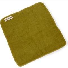 The Woolbuddy Needle Felting Mat Large by Woolbuddy is a green, square wool mat with a small branded tag in the corner, displayed on a white background.