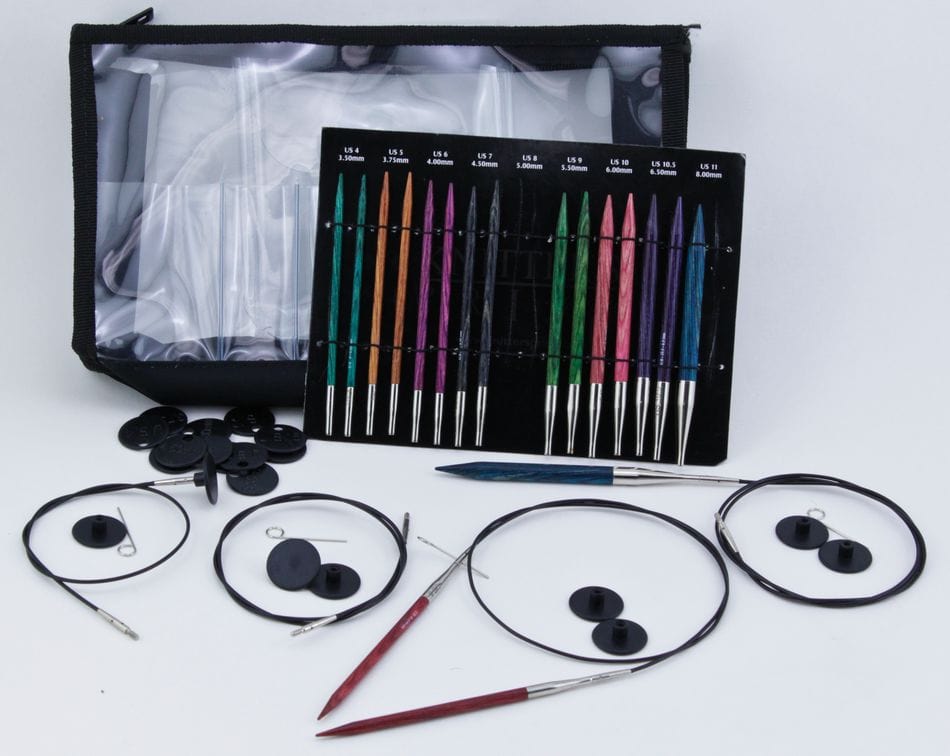The Accessories Unlimited Knit Pro Dreamz Interchangeable Circular Knitting Needle Set, with chunky needles, cables, end caps, and zippered case, is neatly arranged with all tools and accessories displayed in front.