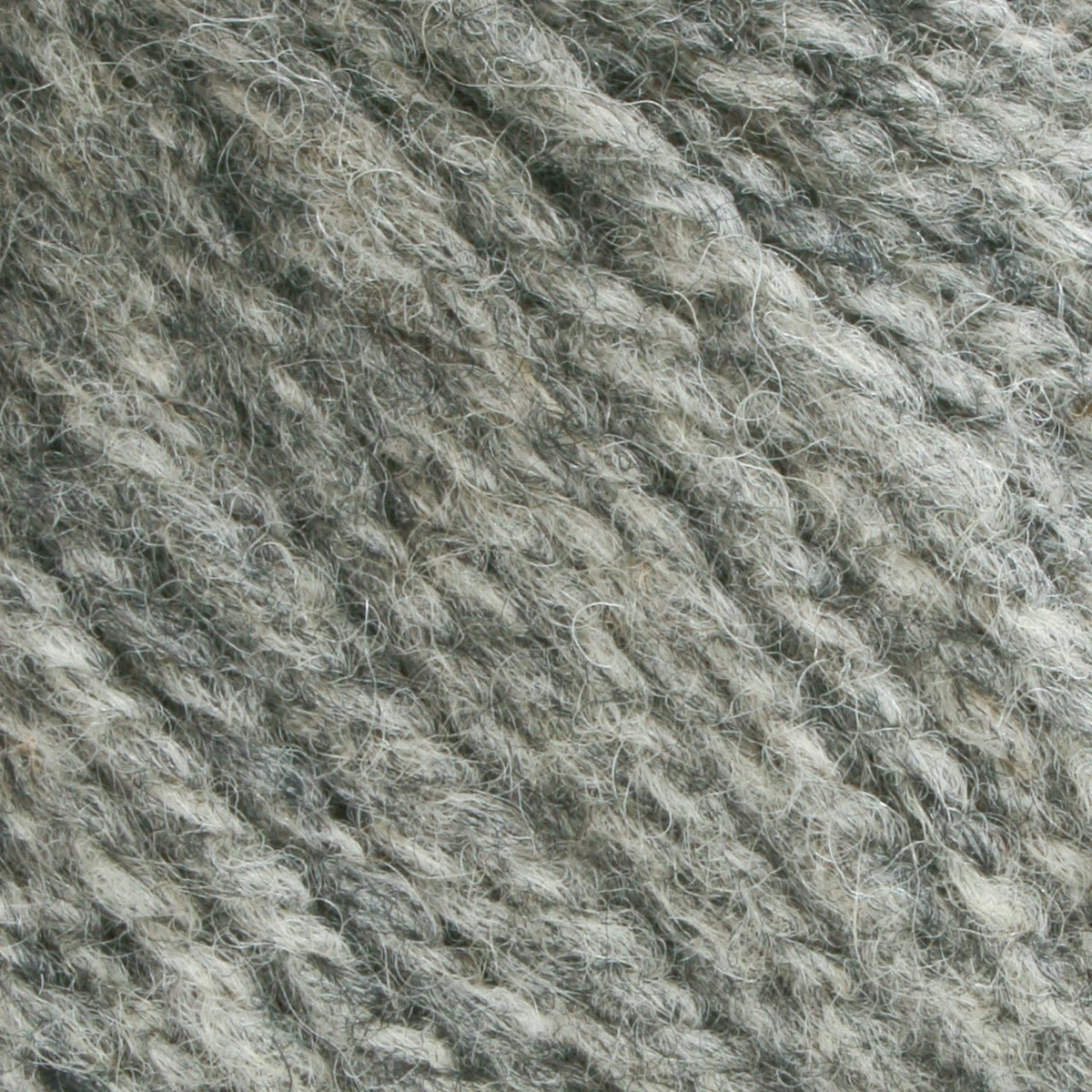 Close-up of Bartlettyarns Maine Wool Yarn (Fisherman 2-Ply): the twisted strands and textured fibers display soft, slightly fuzzy wool with interwoven shades of grey, highlighting the quality from Bartlettyarns.