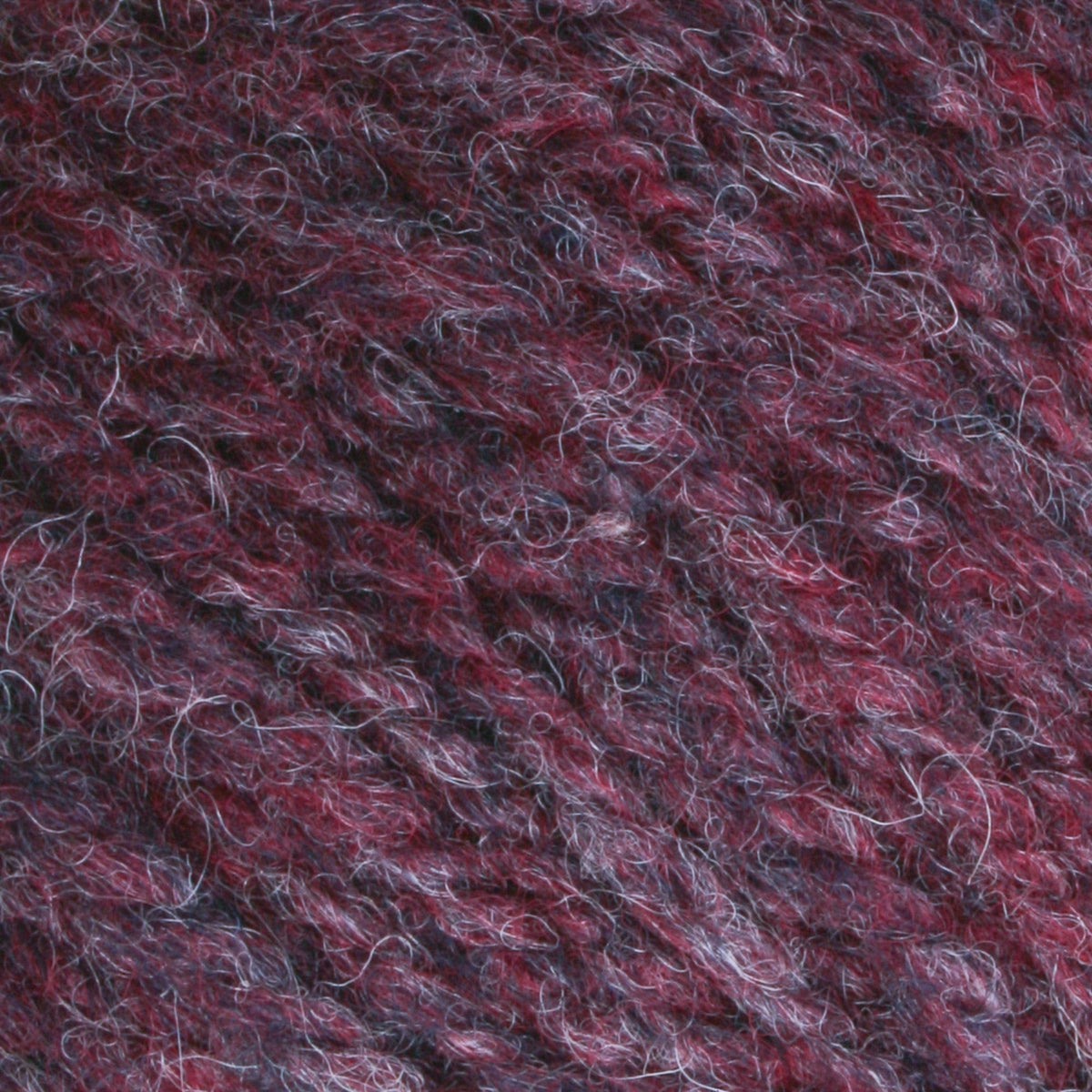 Close-up of Bartlettyarns Maine Wool Yarn (Fisherman 2-Ply) by Bartlettyarns, showing textured worsted weight fibers in burgundy, purple, blue, and white shades with a soft, fuzzy surface.