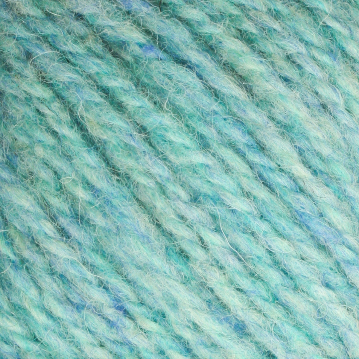 A close-up of Bartlett Maine Wool, Sport Weight Cones by Bartlettyarns reveals turquoise and light blue yarn fibers tightly wound for a textured, homespun look. The intertwined strands create a speckled effect with mixed colors throughout.