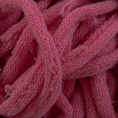 Close-up of tangled pink Harrisville Potholder Loops by Friendly Loom, showcasing their soft texture and intricate weave, reminiscent of the patterns crafted on a traditional loom.