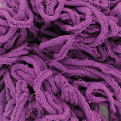 A close-up of the Harrisville Potholder Loops - Traditional Size by Friendly Loom reveals tangled purple loops, highlighting their textured and interwoven strands, reminiscent of the intricate designs crafted on a traditional loom. These soft and dense materials form an elaborate pattern with varying shades of purple.
