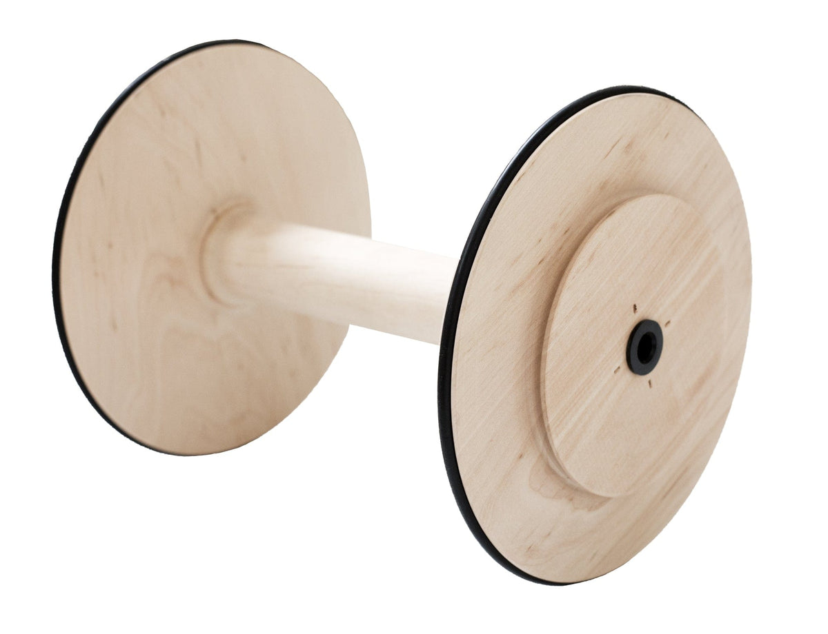 The image shows a Kromski Spinning Wheel Bobbin by Kromski North America, made of light-colored wood with large circular ends outlined in black and a central cylindrical rod, displayed on a white background.