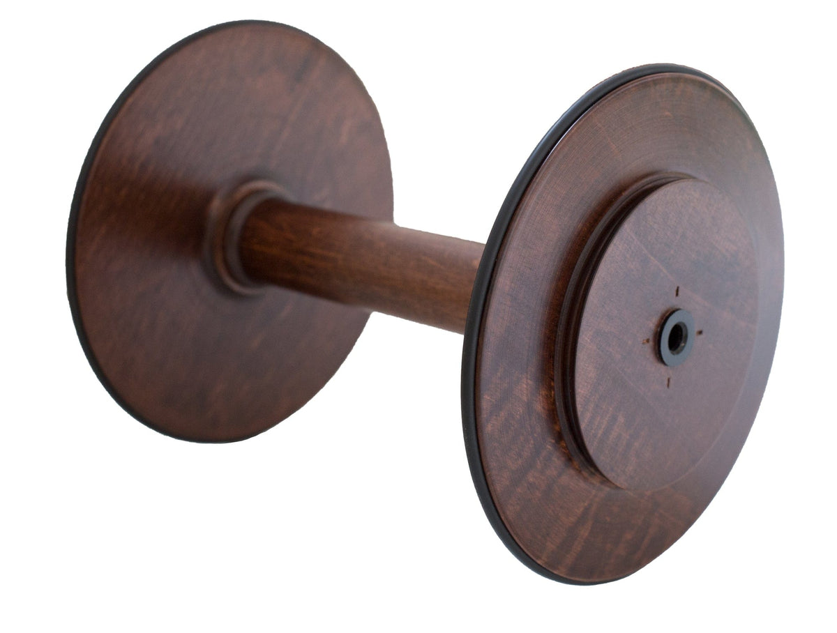 A large empty Kromski Spinning Wheel Bobbin by Kromski North America, featuring two circular ends and a cylindrical center, similar to jumbo bobbins, isolated on a white background.