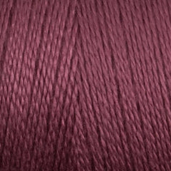 Close-up of Maurice Brassard 8/2 Tencel Yarn | Mini-cone in mauve, tightly wound in parallel strands with a textured, slightly glossy surface—perfect for weaving projects.