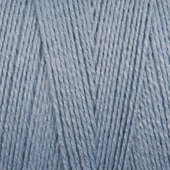 Close-up of Maurice Brassard 8/2 Tencel Yarn | Mini-cone in light blue, showing its fine cellulose fibers twisted into a soft, even weave—ideal for weaving projects.