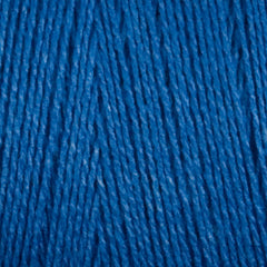 Close-up of Maurice Brassard 8/2 Tencel Yarn | Mini-cone in blue, showing its tightly packed cellulose fibers and rich texture—ideal for intricate weaving projects.