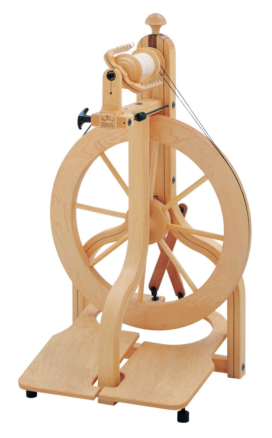 The Schacht Matchless Spinning Wheel from Schacht Spindle Co. is a hardwood spinning wheel with a large central wheel, double treadle base, and top spindle for turning fibers into yarn.
